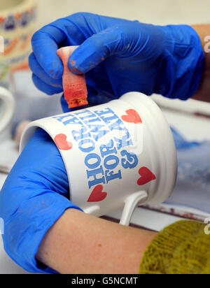 Commemorative mugs being produced at the Emma Bridgewater Pottery in Stoke On Trent. Stock Photo