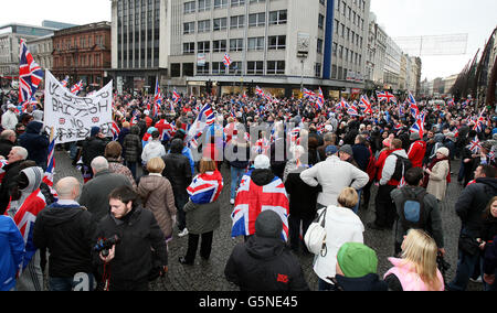 Loyalists protesters in Belfast city centre for a protest against new restrictions on flying the Union flag. PRESS ASSOCIATION Photo. Picture date: Saturday December 8, 2012. A major security operation is under way to prevent more trouble breaking out at the demonstration in front of City Hall. There was a heavy police presence in the area but the atmosphere was said to be calm and the crowds have already began to disperse. Eight police officers were injured and more than a dozen people arrested during overnight clashes between loyalists and riot police. PSNI Assistant Chief Constable Will Stock Photo