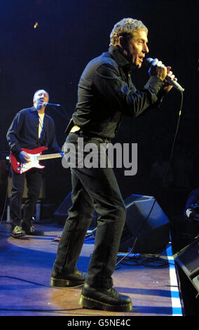 Roger Daltrey, lead singer of veteran rock band The Who and guitarist Pete Townshend perform on stage at the Royal Albert Hall, London during a fundraising concert in aid of the Teenage Cancer Trust. Stock Photo