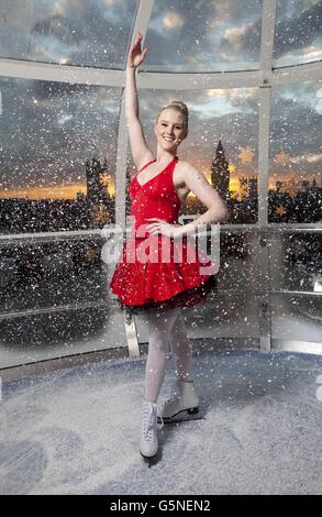 Charlotte Jeffery poses in a capsule of the EDF Energy London Eye which has taken on the appearance of a festive snow globe to celebrate the London Eye's Christmas offerings including Eyeskate. Stock Photo