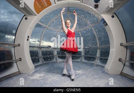 Charlotte Jeffery poses in a capsule of the EDF Energy London Eye which has taken on the appearance of a festive snow globe to celebrate the London Eye's Christmas offerings including Eyeskate. Stock Photo