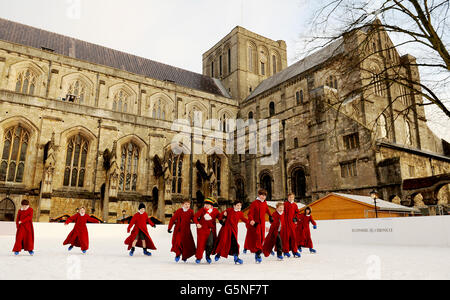 The Boy Choristers of Winchester Cathedral skate on the Cathedral's ice rink. Stock Photo