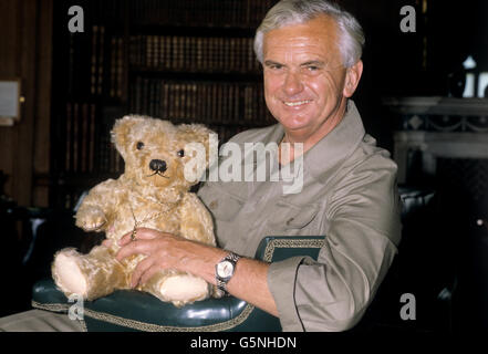 BBC newscaster Kenneth Kendall with his teddy bear Teddygiles at a charitable event at Longleat House in Wiltshire. Stock Photo