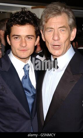 Actors Orlando Bloom (left) and Sir Ian McKellen arrive for the Orange British Academy Film Awards at the Odeon cinema in London's Leicester Square. Stock Photo