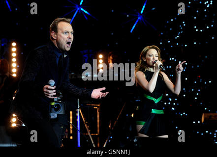 Kylie Minogue and Jason Donovan perform during the Hit Factory Live Christmas Cracker concert, at the O2 arena in London. Stock Photo