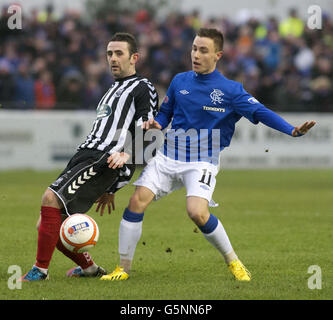 Soccer - Irn Bru Scottish Third Division - Elgin City v Rangers - Borough Briggs. Rangers' Barrie McKay and Elgin's Paul Harkins during the Irn Bru Scottish Third Division match at Borough Briggs, Elgin. Stock Photo