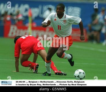 25-06-94. Belgium v Netherlands .Vincenzo Scifo, Belgiuum is beaten by Bryan Roy, Netherlands. Picture by Neal Simpson Stock Photo