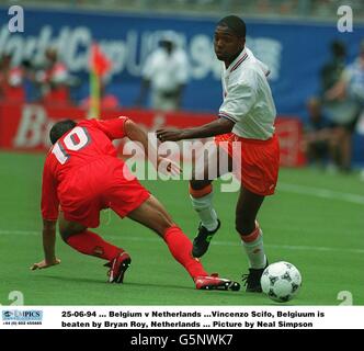 25-06-94. Belgium v Netherlands .Vincenzo Scifo, Belgiuum is beaten by Bryan Roy, Netherlands. Picture by Neal Simpson Stock Photo