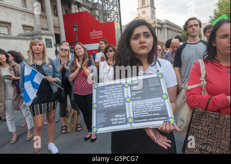 London, UK. June 21st 2016. Around a thousand people at a rally to in Trafalgar Square demonstrate to show a younger generation standing united against prejudice and hate and calling for a vote to remain in Europe in the referendum. A woman holds a poster with the message 'If people like Rupert Murdoch, Nigel Farage, George Galloway, Nick Griffin and Marine LePen want Britain to leave the EU - Where does that put you? Peter Marshall/Alamy Live News Stock Photo