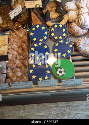 'Europeans, ' a variation of black and white cookie known as an 'American' in Germany, are can be seen in the display case at the German gourmet food shop 'Hansel & Pretzel' in the district of Richmond in London, Great Britain. The owners of the shop, Peter Wengerodt and Petra Braun, are using the cookie to alert their customers to the fact that they depend on the currency exchange between the euro and pound. The 'European' is 20 cents more than a normal 'American.' If the pound loses value in the case of a Brexit, then they will have to buy their products at a higher price in Germany and rais Stock Photo