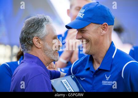 Comedian Jon Stewart presents medically retired Capt. Chris Cochrane the Heart of Team Award on behalf of the Air Force Team at the 2016 Department of Defense Warrior Games during closing ceremonies at the U.S. Military Academy June 21, 2016 in West Point, New York. Stock Photo