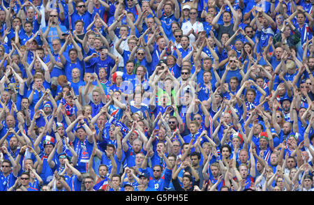 St. Denis, France. 22nd June, 2016. Iceland's supporters cheer during the Group F preliminary round soccer match of the UEFA EURO 2016 between Iceland and Austria at the Stade de France in St. Denis, France, 22 June 2016. Photo: Peter Kneffel/dpa/Alamy Live News Stock Photo