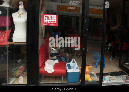 London, UK. 23rd June, 2016. A vote to remain poster on a shop front in Peckham as people vote in the UK referendum . Credit:  Thabo Jaiyesimi/Alamy Live News Stock Photo