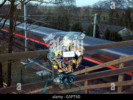 Flowers are left at the scene of the Selby Rail crash to mark the first anniversary of the tragedy in which ten people were killed. Survivors and relatives of the victims met at the scene of the disaster for an act of remembrance. * Around 25 people gathered at the Great Heck site in North Yorkshire at 6.15am - the exact time when the disaster occurred on February 28 last year. As relatives and survivors stood close to the rail tracks, a passenger train and a freight train passed each other slowly at the scene, sounding their horns. Stock Photo