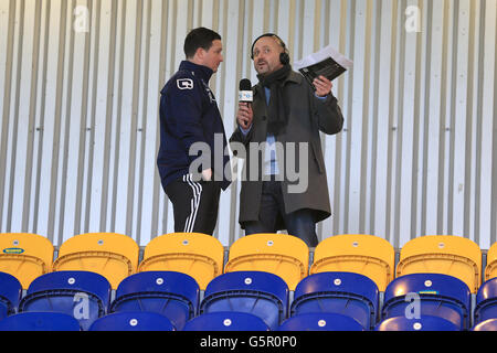 Soccer - FA Cup - Third Round - Mansfield Town v Liverpool - One Call Stadium. Mansfield Town manager Paul Cox (left) is interviewed by Mark Clemmit for BBC Radio 5 Stock Photo