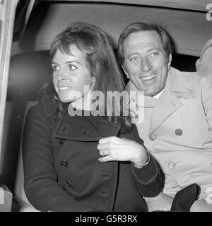 American singer, Andy Williams, with his French-born actress-singer wife, Claudine Longet, arrive in England. Andy Williams is appearing in Monday's Royal Variety Show at the London Palladium. Stock Photo