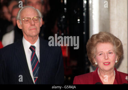 Prime Minister Margaret Thatcher with husband Denis outside 10 Downing Street before leaving for Buckingham Palace to offer her resignation to the Queen. Stock Photo