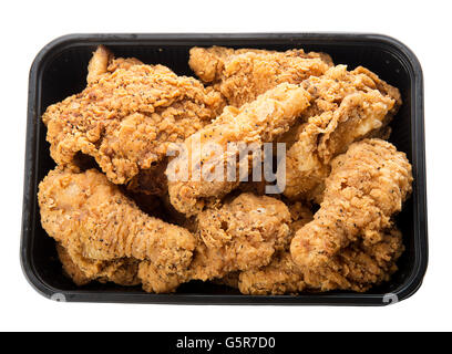 Close up of fried chicken in a plastic container isolated on white Stock Photo