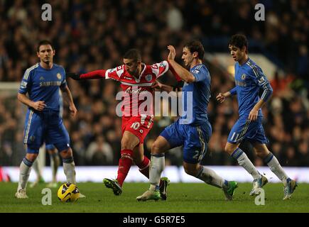 Soccer - Barclays Premier League - Chelsea v Queens Park Rangers - Stamford Bridge. Chelsea's Branislav Ivanovic (right) and Queens Park Rangers' Adel Taarabt (left) battle for the ball Stock Photo