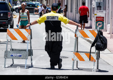 Miami Beach Florida,security guard,adult,adults,man men male,working work worker workers,employee staff,barricade,FL160530085 Stock Photo
