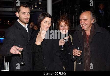 Actor Jude Law (left) and his wife Sadie Frost (2nd left) share a drink with Jude's parents Meggie and Peter Law at a party at the British Airways London Eye on London's South Bank, after the opening performace of Jude's new play Dr Faustus at the Young Vic theatre. Stock Photo