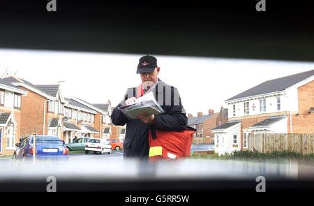A postman delivers the morning mail in Newcastle on the day that Consignia was expected to announce thousands of job losses as part of a massive restructuring programme. 16/09/2003 Postal workers were today awaiting the result of a ballot which could lead to the first national mail strike for seven years. The Communication Workers Union will officially announce the outcome of the vote which could see walkouts begin as early as next week. It follows last-ditch talks aimed at averting the industrial action which were adjourned late last night without any sign of agreement, a spokesman for the Stock Photo
