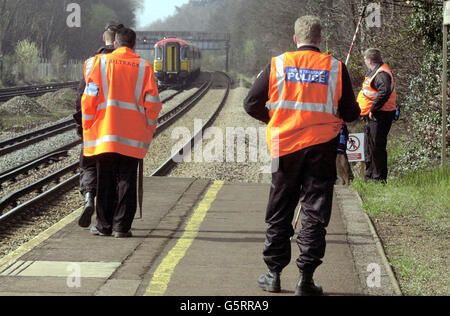 Police search along the railway track at Walton-on-Thames, Surrey for missing girl Amanda Dowler. More than 100 officers from Surrey Police were combing the streets, railway line and the countryside looking for signs of the 13-year-old, nicknamed Milly. * ... who went missing in Walton-on-Thames, as she made her way home from the railway station when she disappeared. Stock Photo