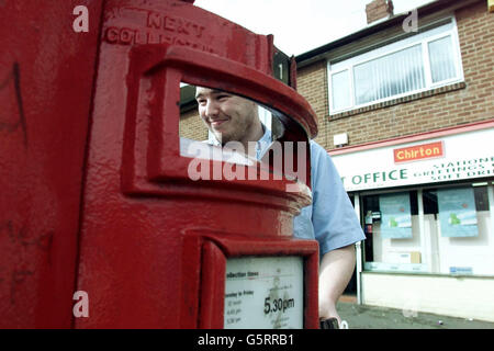 A postman collects the morning mail in North Shields, Newcastle. Consignia has announced the loss of 15,000 postal jobs as the company tries to recover from crippling daily losses of 1.5 million. * ... Unions condemned moves to scale down Consignia's struggling Parcelforce Worldwide business as 50 Parcelforce depots are shut across the UK, alongside four mail distribution centres. The measures are the first step in Consignia's three-year rescue package to cut costs by 1.2 billion. Stock Photo