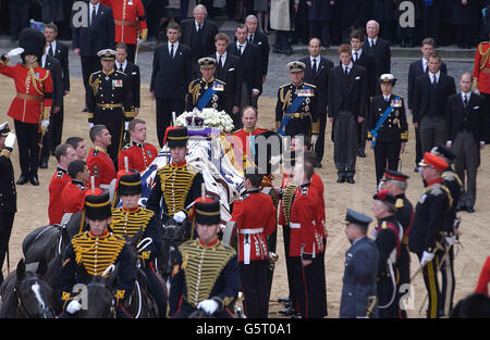 Members of the Royal Family follow the coffin of Queen Elizabeth , the Queen Mother on its way to Westminster Abbey. After the service, the Queen Mother's coffin will be taken to St George's Chapel in Windsor, where she will be laid to rest next to her husband, King George VI. Stock Photo