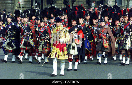British Army pipers from various Scottish regiments head the parade carrying the coffin of the Queen Mother to Westminster Abbey in central London. Royal dignitaries and politicians from around the world have gathered at Westminster Abbey to pay their respects to the Queen Mother. 8.., who died on March 30, 2002, aged 101. She will be interred at St George's Chapel in Windsor next to her late husband King George VI. Stock Photo