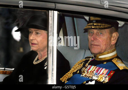Britain's Queen Elizabeth II and the Duke of Edinburgh leave after the funeral service of the Queen Mother at Westminster Abbey. The funeral is the culmination of more than a week of mourning for the royal matriarch, who died at the age of 101. Stock Photo
