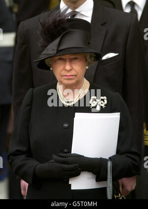 Britain's Queen Elizabeth II watches as Queen Elizabeth the Queen Mother's coffin is driven from Westminster Abbey, London. After the service, the Queen Mother's coffin will be taken to St George's Chapel in Windsor, where she will be laid to rest. * ... next to her husband, King George VI. Stock Photo