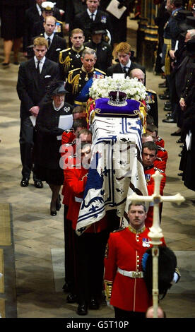 Members of the British Royal Family follow the Queen Mother's coffin out of Westminster Abbey after the funeral service in London. The funeral is the culmination of more than a week of mourning for the royal matriarch, who died March 30 at the age of 101. Stock Photo