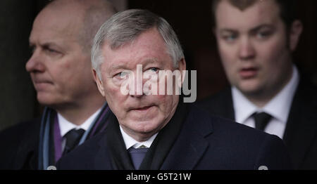 Sir Alex Ferguson attends the funeral of former Celtic assistant manager Sean Fallon at Christ the King Church in Glasgow, Scotland. Stock Photo