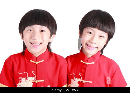 Cute boys wearing red Chinese suit Stock Photo