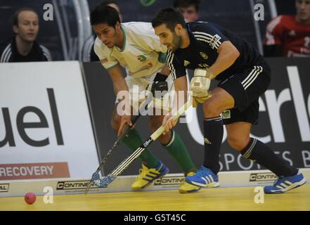 Canterbury's Devohn Teixeira (left) challenges East Grinstead's Tim Strueven during the Maxifuel Super Sixes First semi-final at Wembley Arena, London. Stock Photo