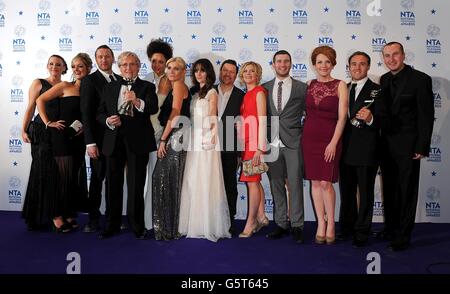 Cast and crew from Coronation Street including Willam Roache, Natalie Gumede, Michelle Collins, Paula Lane, Jane Danson, Ian Puleston-Davies and Jennie McApline with their Best Serial Drama Award, in the press room at the 2013 National Television Awards at the O2 Arena, London. Stock Photo