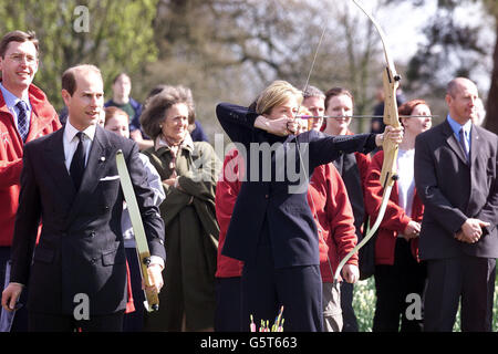 Prince Edward, the Earl of Wessex accompanied by the Countess of Wessex try their hand at archery at Barnetts Park in Belfast during a visit to a project run by the Duke of Edinburgh Award Scheme as the couple enjoy a two day visit to the province. Stock Photo