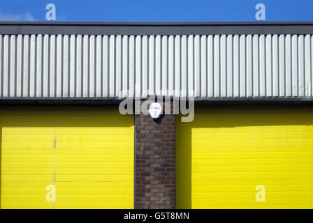 Yellow doors in an industrial unit Stock Photo