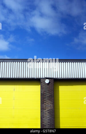Yellow doors in an industrial unit Stock Photo