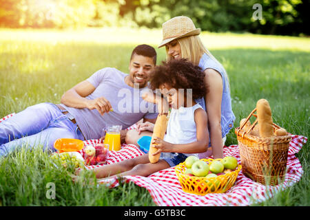 Family enjoying picnicking in nature Stock Photo