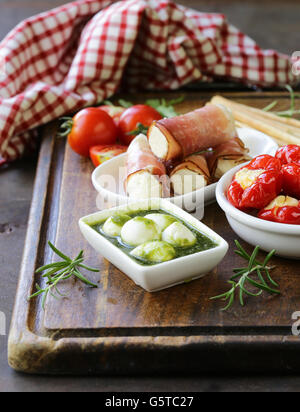 Italian appetizer antipasti made dish - ham, cheese, peppers Stock Photo