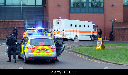 Armed police stand guard as a prison van arrives at Preston Crown Court, where the trial of Dale Cregan, who is charged with the murders of Pc Nicola Hughes and Pc Fiona Bone who were killed in a gun and grenade attack last year, is due to start today. Stock Photo