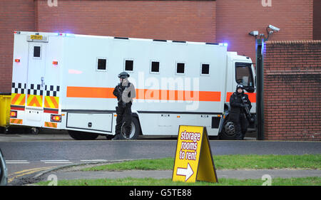 Armed police stand guard as a prison van arrives at Preston Crown Court, where the trial of Dale Cregan, who is charged with the murders of Pc Nicola Hughes and Pc Fiona Bone who were killed in a gun and grenade attack last year, is due to start today. Stock Photo