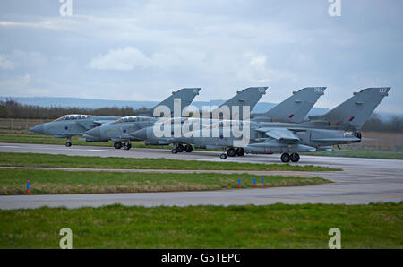 A Flight of four GR4 RAF Tornadoes prepare for take off at Lossiemouth Air Base on the Moray Coast Scotland.  SCO 10,530. Stock Photo