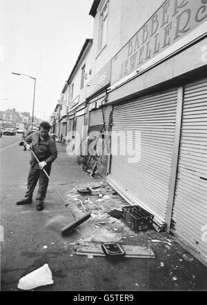 Sweeping up begins in Handsworth, Birmingham, after a night of looting. Stock Photo