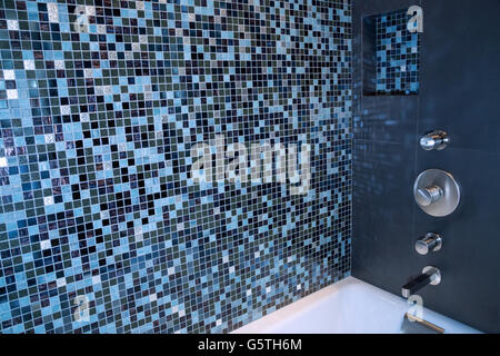Mosaic tiled wall inside shower bath Stock Photo