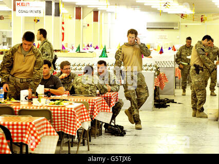 Prince Harry or just plain Captain Wales as he is known in the British Army, with fellow air crew in the DFAC (Dining Facility), at Camp Bastion southern Afghanistan, where he is serving as an Apache Helicopter Pilot/Gunner with 662 Sqd Army Air Corps, from September 2012 for four months until January 2013. 11/12/2012. Stock Photo