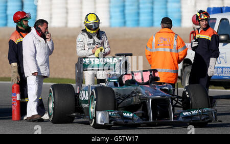 Formula One - Testing - Circuito de Jerez. Nico Rosberg surveys the damage to his Mercedes after stopping on the track during a testing session at Circuito de Jerez, Jerez, Spain. Stock Photo