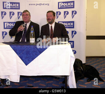 Home Secretary David Blunkett (right) with Fred Broughton - Chairman of the Police Federation of England & Wales after their speeches at the Police Federation Conference in Bournemouth. Stock Photo